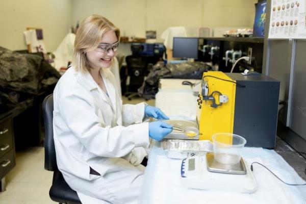 Molly Lobel in Tayo Adedokun's poultry lab