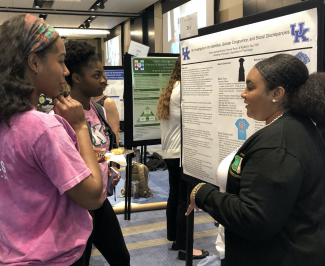Showcase 2019 student presenting research poster