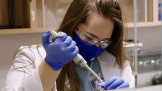 Katie Land research ambassador in the lab 2021
