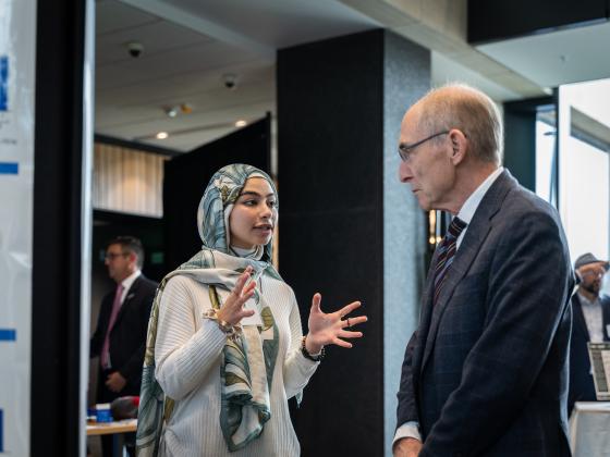 Beckman Scholar Elaf Ghoneim and President Capilouto at the Board of Trustees Meeting in October 2022
